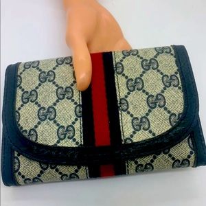 Authentic Gucci wallet w/coin slot. Used but great condition.